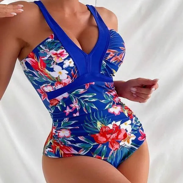 Women's black floral backless one-piece swimsuit on a mannequin