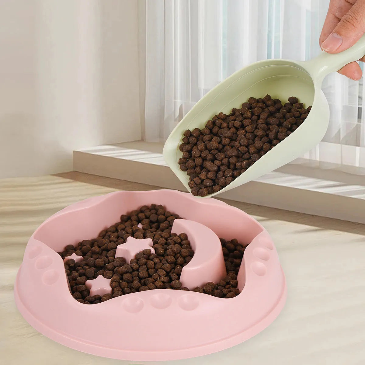 Moon Star Wings large slow-feeding pet bowl in blue, showing internal raised centre and wing design