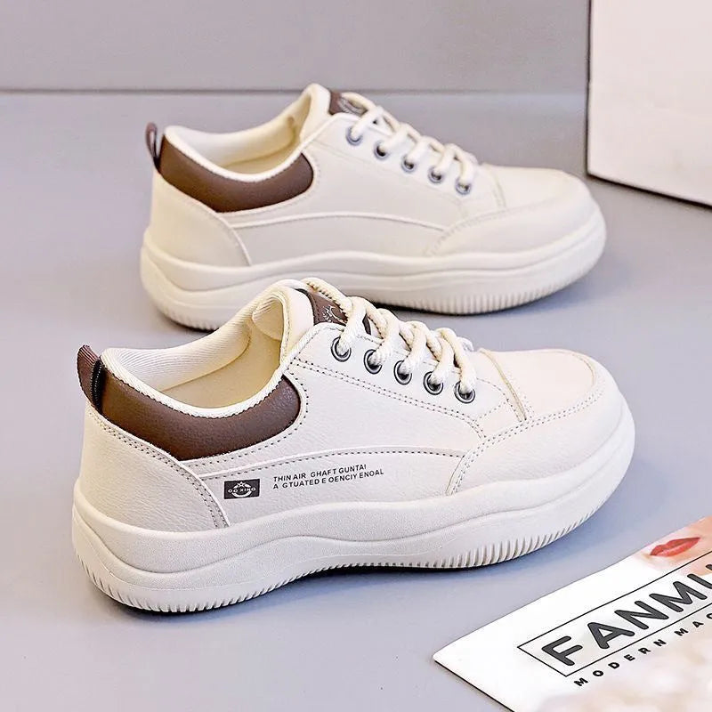 Women's white Korean style low top pumps with round head, cross straps, and rubber sole
