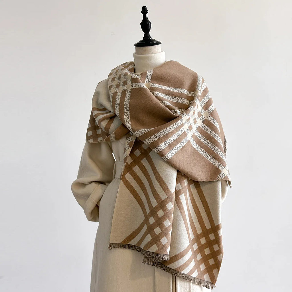 Mid-length brown cashmere-like scarf with tassel ends laid flat.