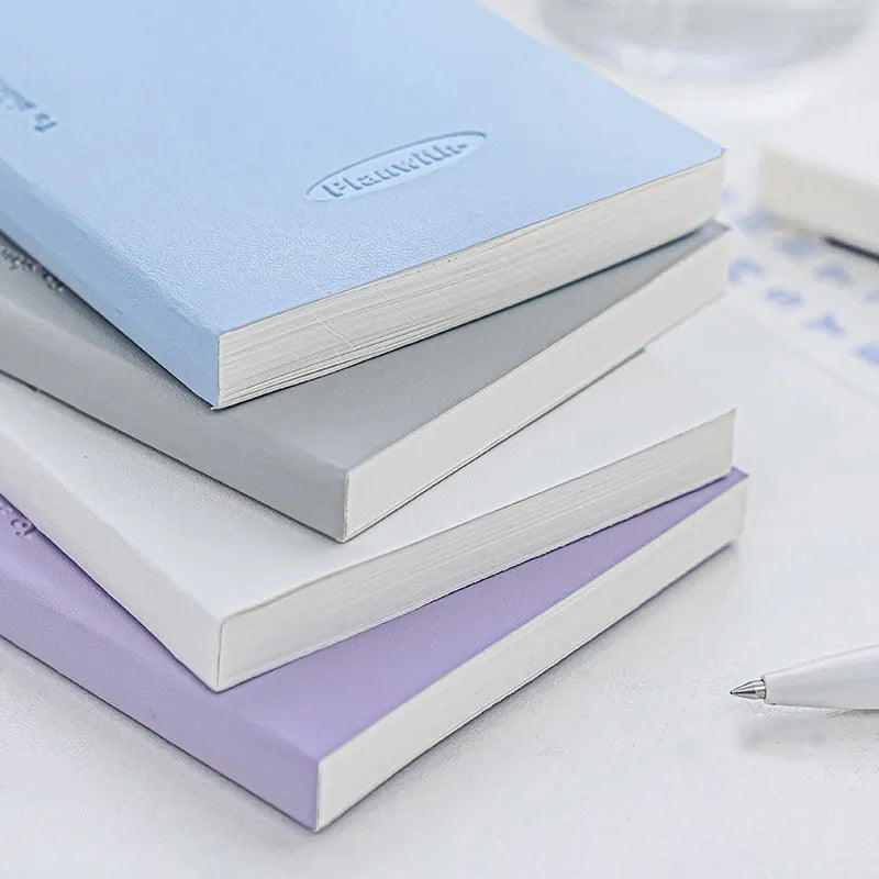 Embossed A5 daily meter book notebook showing blue, grey, purple, and white cover colour options.