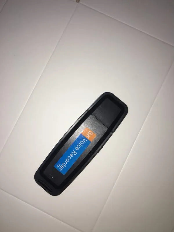 Black and white SK-001 SK-868 creative USB flash drive with voice function showing size scale.