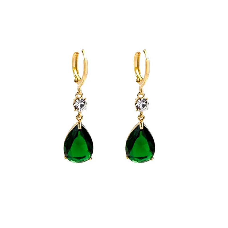 A pair of green geometric teardrop-shaped alloy earrings on a plain background.