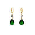 A pair of green geometric teardrop-shaped alloy earrings on a plain background.