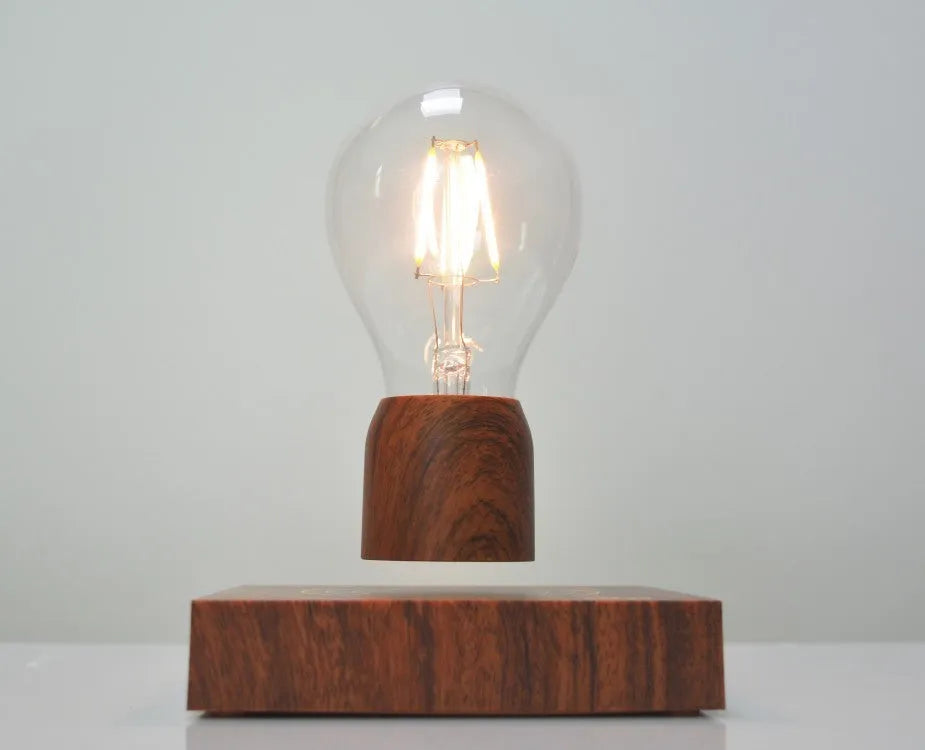 Magnetic levitation floating light bulb with imitation wood base and glass enclosure