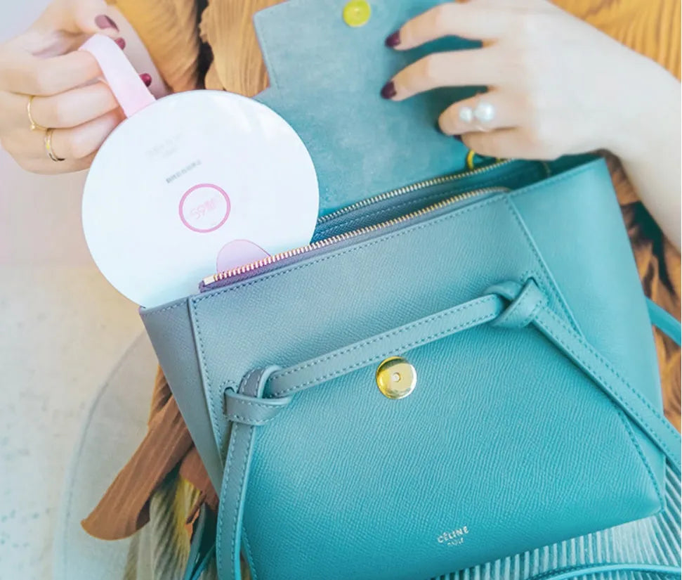 Slim blue portable UV-C baby bottle steriliser showing USB port and dimensions