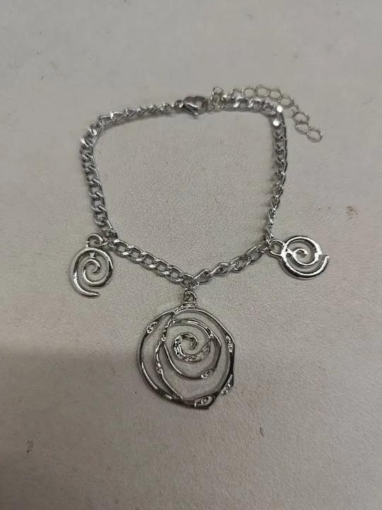 Spiral donut jewellery set with necklace, bracelet and ear hooks in gold or silver tone
