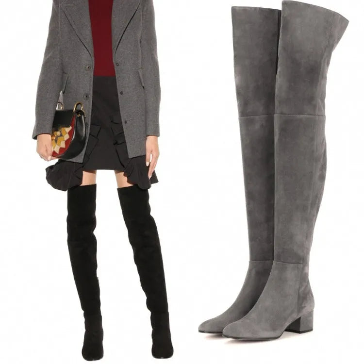 Grey women's flat over-the-knee suede boots with a pointed toe and low thick heel.