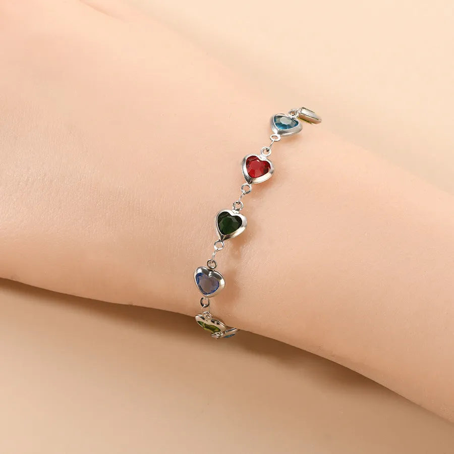 Devil's Eye geometric heart bracelet in stainless steel, shown in colourful, blue, green, or red electroplated finish
