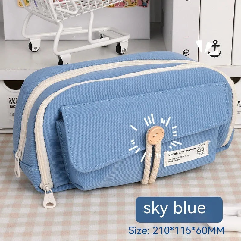 Korean style canvas pencil case in green, beige, blue, or grey, showing large capacity for pens.