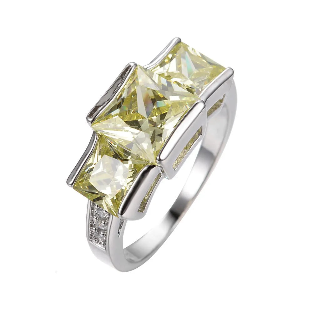 A geometric copper ring in multiple colour options on a size chart showing rings 6 to 10.