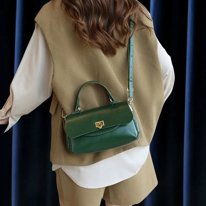 Women's brown leather saddle handbag with open outer pocket and double shoulder straps