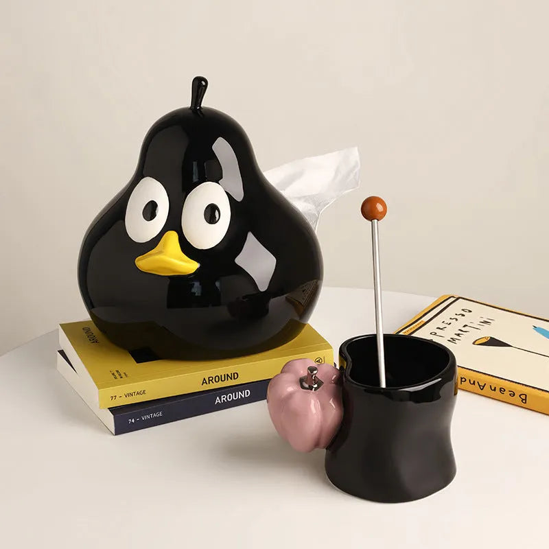 Green ceramic pear-shaped tissue box with cute animal design on white background