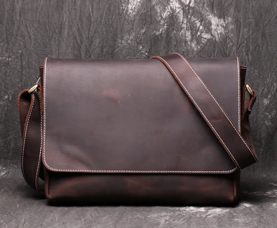 Men's vintage brown leather messenger bag with flap cover and adjustable shoulder strap