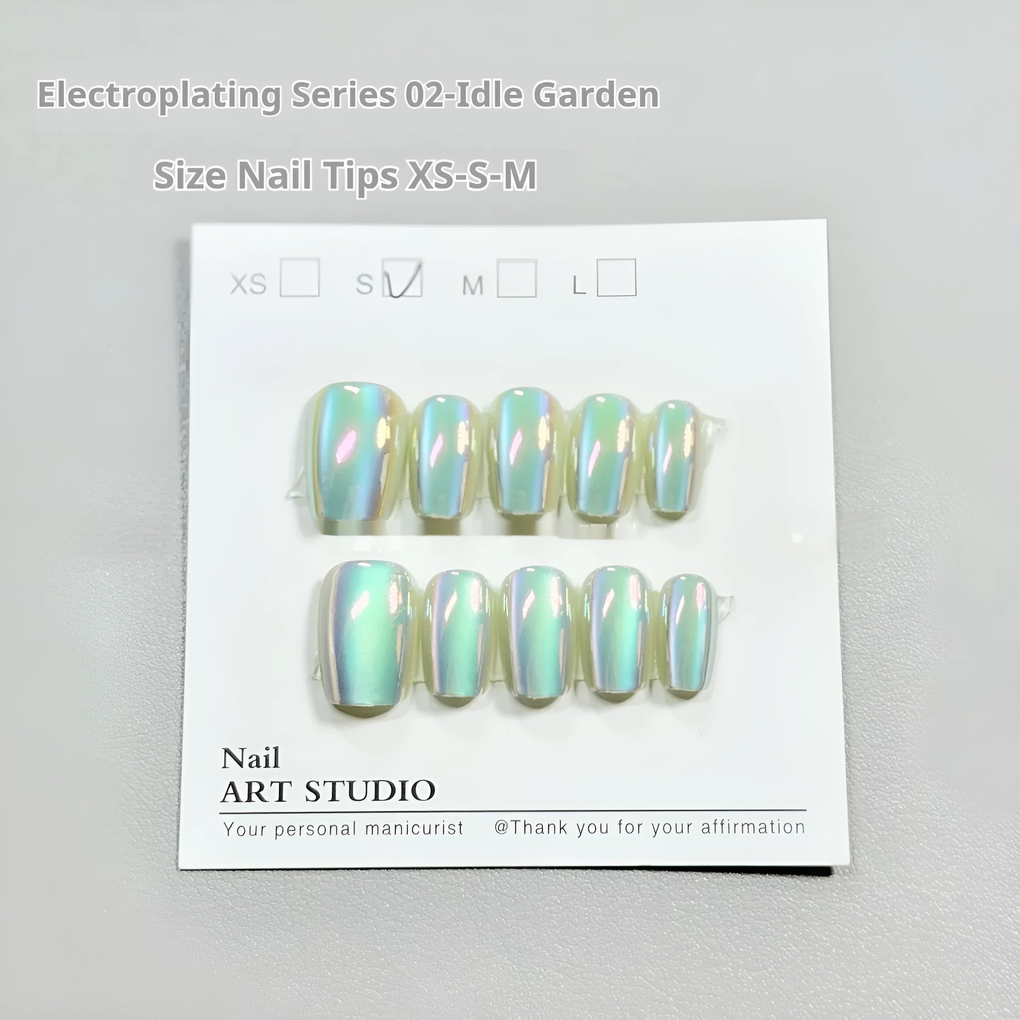 Set of electroplated Cat's Eye false nails in short ladder shape showing Aurora armour and solid colour finishes.