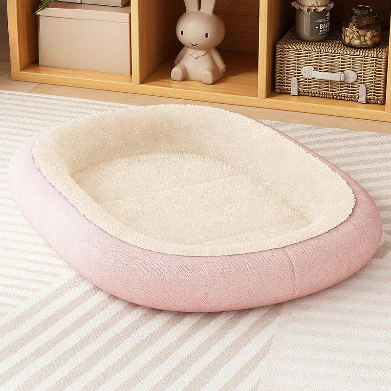 A thickened grey dog kennel for a small dog, shown alongside green and pink colour options.