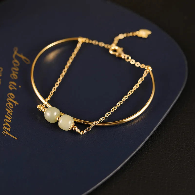 Hetian jade lucky beads bracelet for women with gold inlay, shown in single, double and three bead versions.