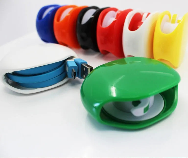 Automatic earphone cable winder retractor in assorted colours on a white background.