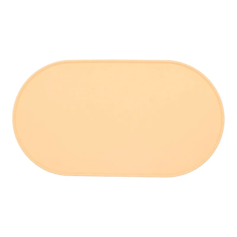 Silicone cat feeding placemat in beige colour showing non-slip underside and waterproof surface.