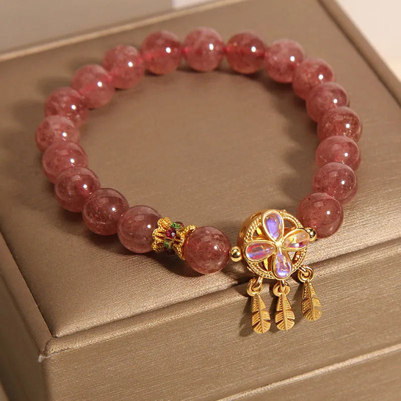 Women's strawberry quartz crystal bracelet with four leaf dream catcher ball pendant