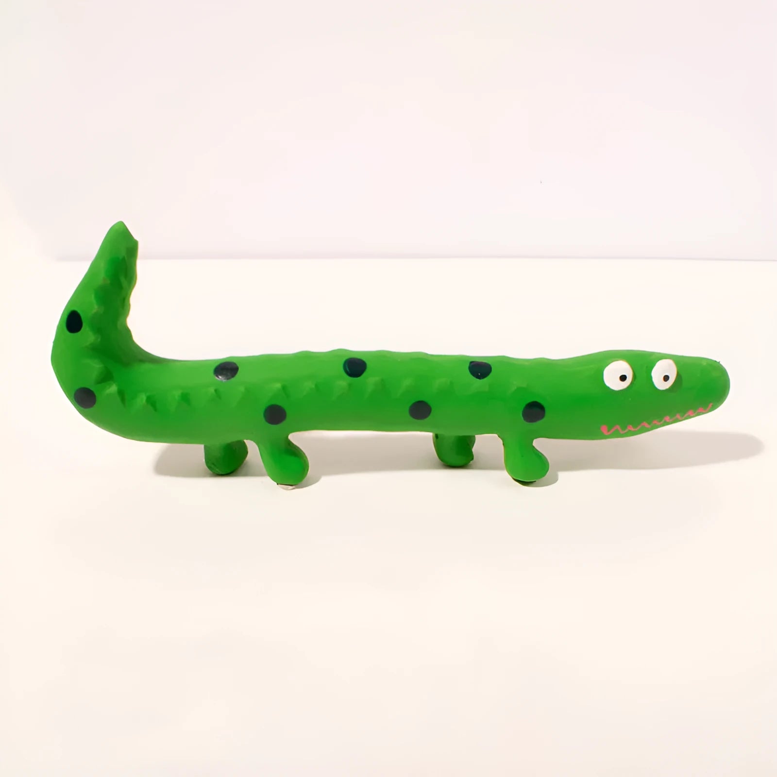 Green cartoon lizard shaped dog chew toy with squeaker measuring 24x10x3cm