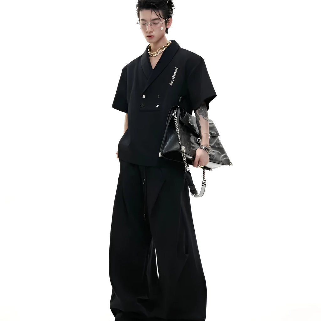 Men's dark grey cotton sports suit with padded shoulders, metal embellishments, V-neck, and matching shorts