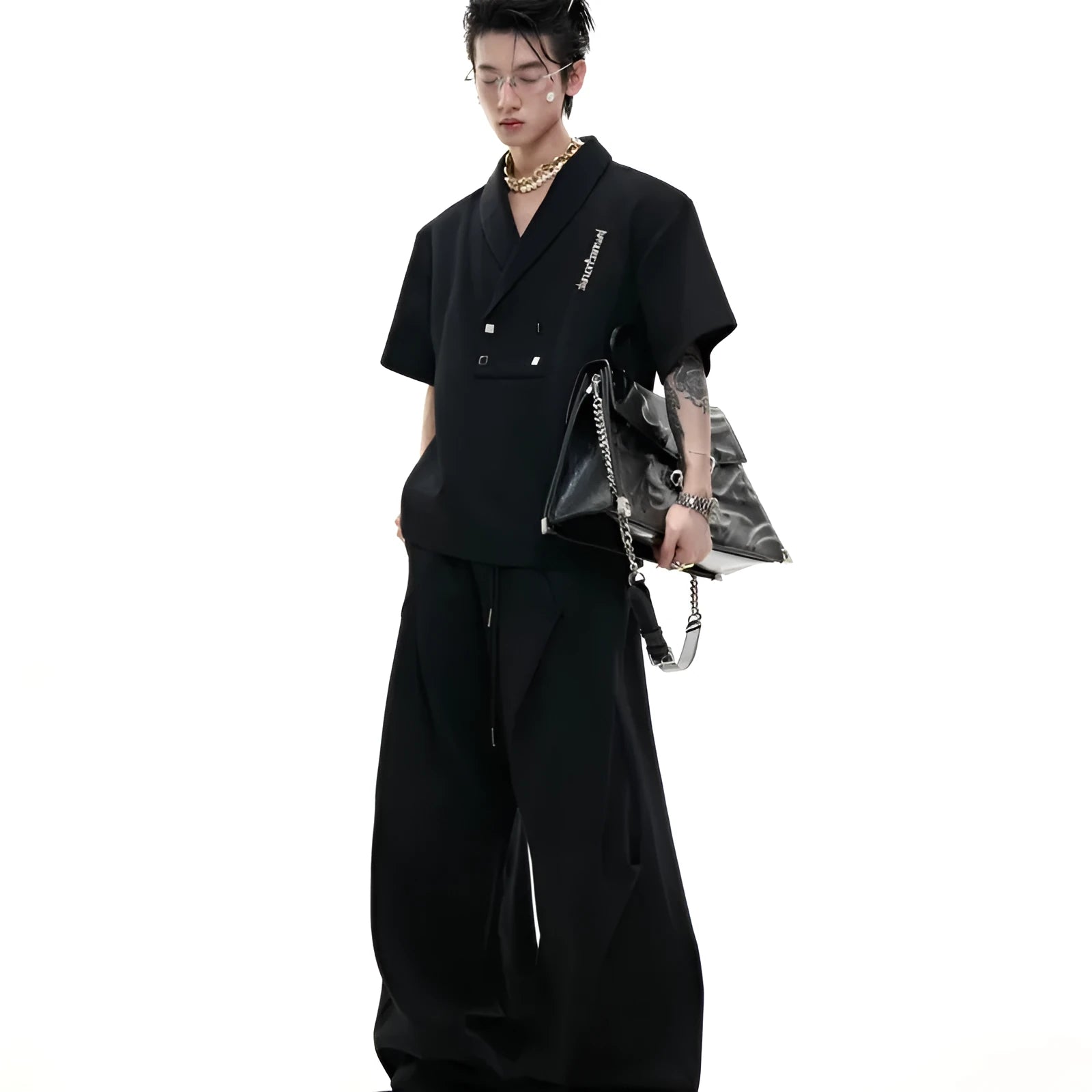 Men's dark grey cotton sports suit with padded shoulders, metal embellishments, V-neck, and matching shorts