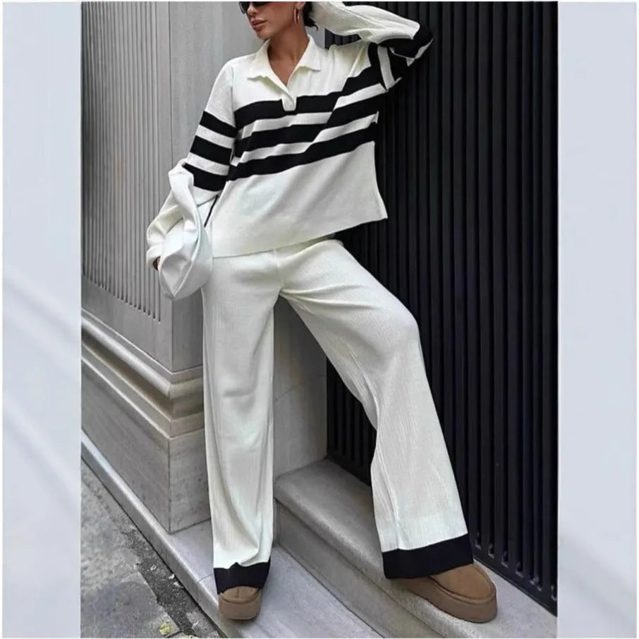 Women's black and white striped knitted two-piece set with polo collar shirt and matching trousers