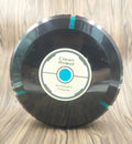 Black or white automatic sweeping robot vacuum cleaner on wooden floor