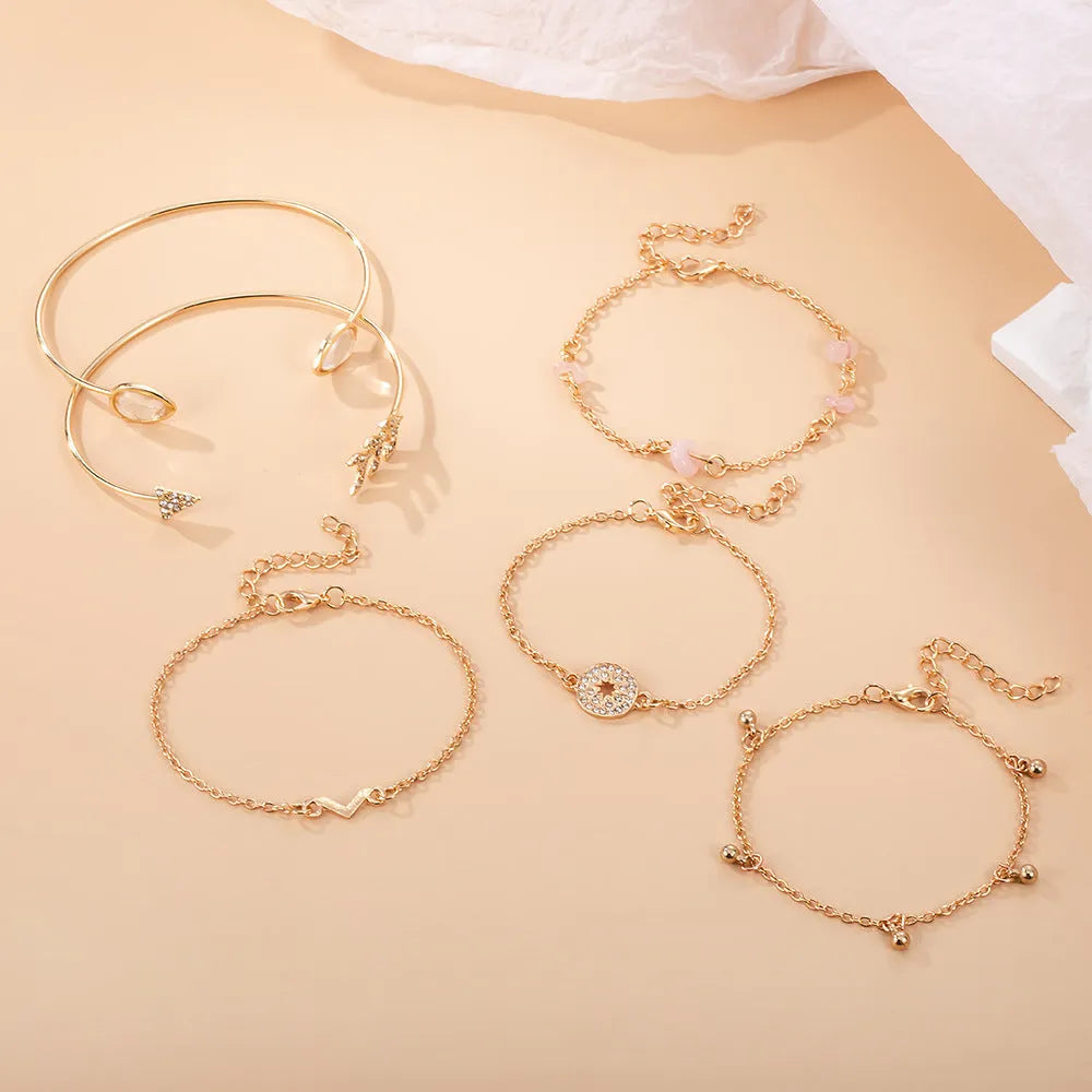 Gold zinc alloy bracelet set with water drop and arrow charms