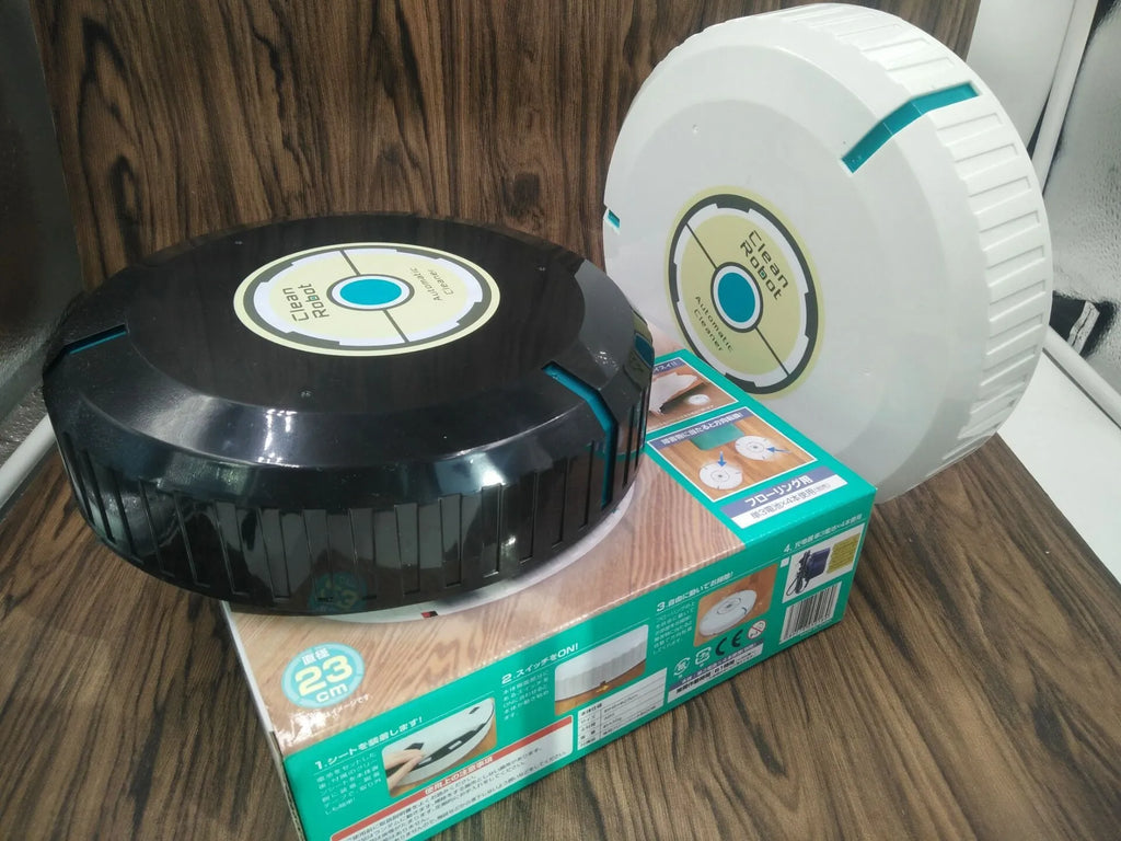 Black or white automatic sweeping robot vacuum cleaner on wooden floor