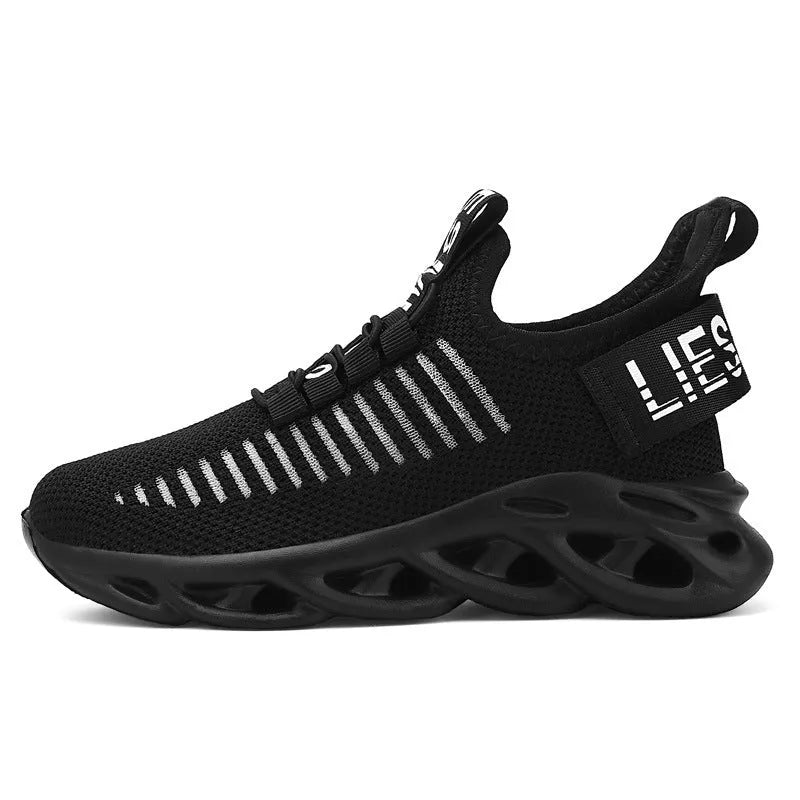 Children's fabric sneakers with Velcro strap in black, khaki, and white colours on a neutral background.