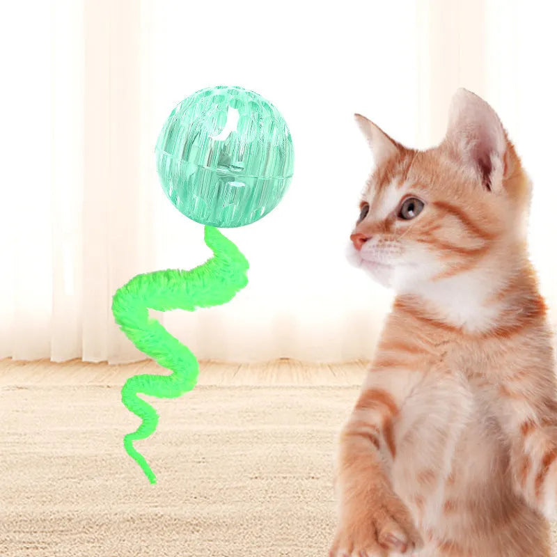 Interactive worm-shaped bouncy ball cat toy with tail in green, pink, or purple colours