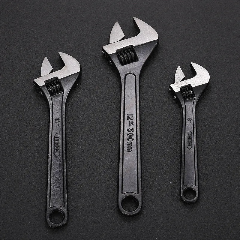 Stainless steel adjustable wrench with blackened finish showing adjustable jaw mechanism