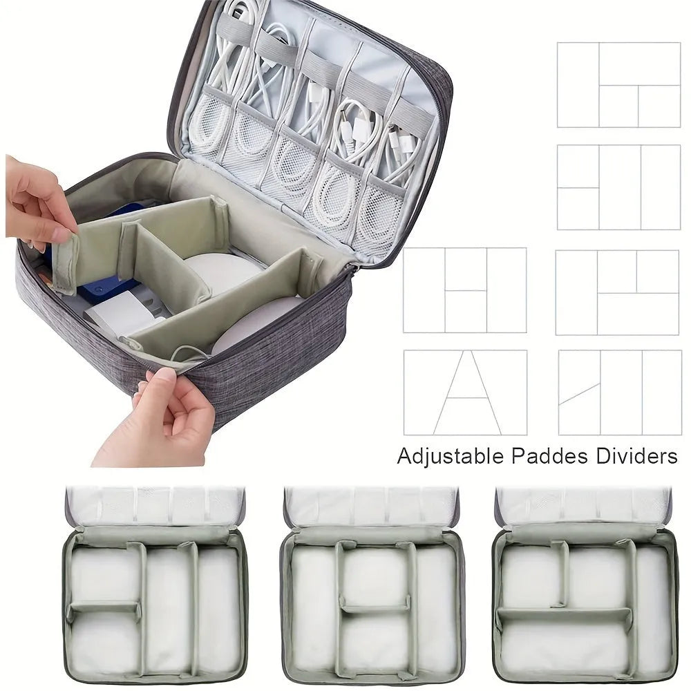 Black travel cable organiser bag open to show mesh pockets, elastic loops, and removable padded dividers inside.
