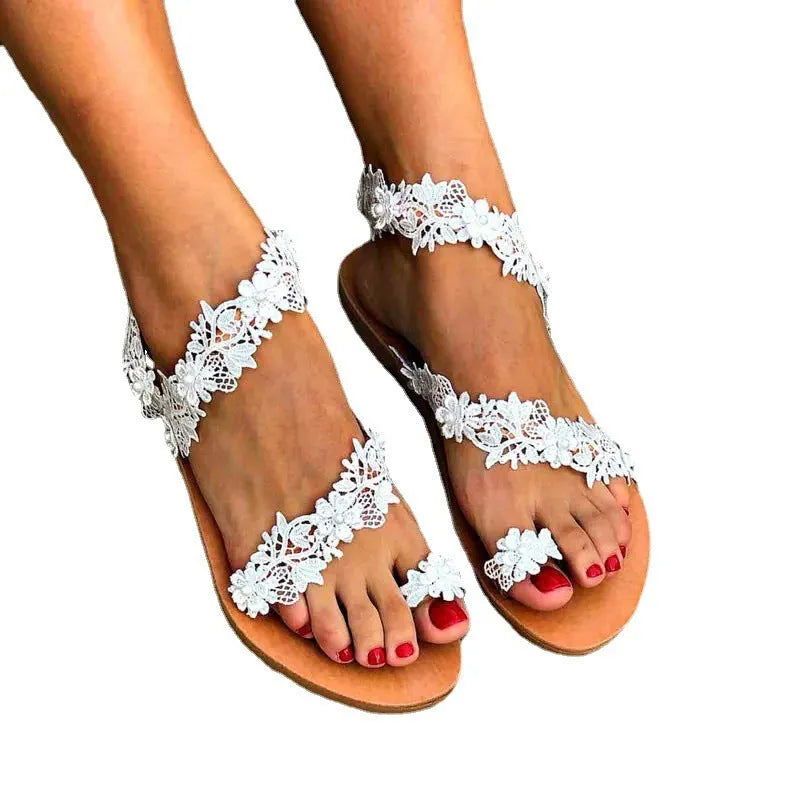 White women's sandals with floral rhinestone decoration and round toe design