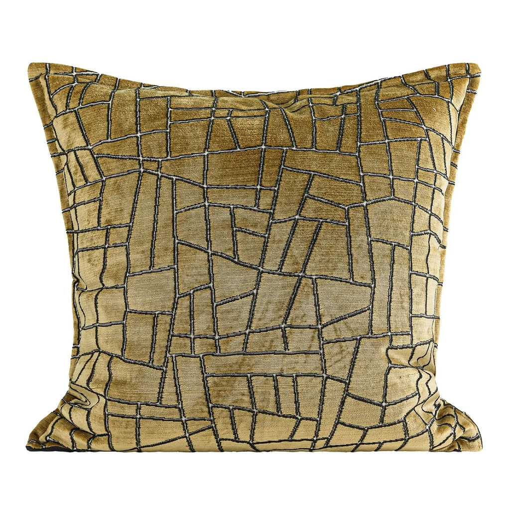 Geometric abstract patterned cushion in local gold colour, shown in square and lumbar sizes on a grey sofa.