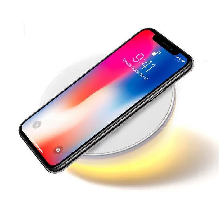 White wireless phone charger with clock display and three control buttons