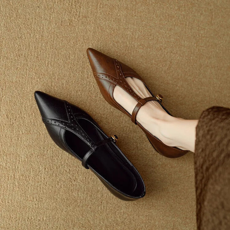 Brown women's pointed toe low-cut flat shoes with a mid heel on a neutral background.