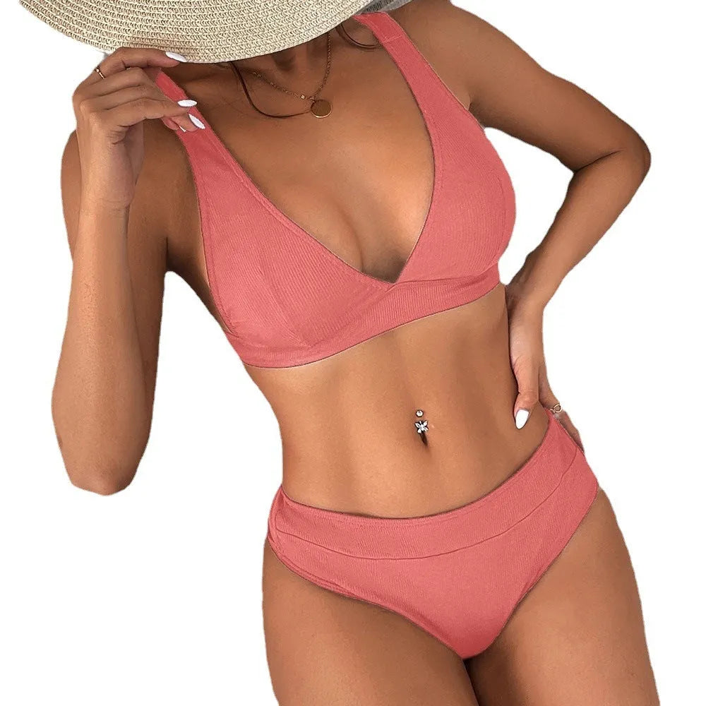 Women's black lace-up front bikini set with high-waist briefs on a mannequin.
