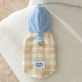 Blue corduroy hooded vest for pets with a grid pattern and traction elements on the hood.
