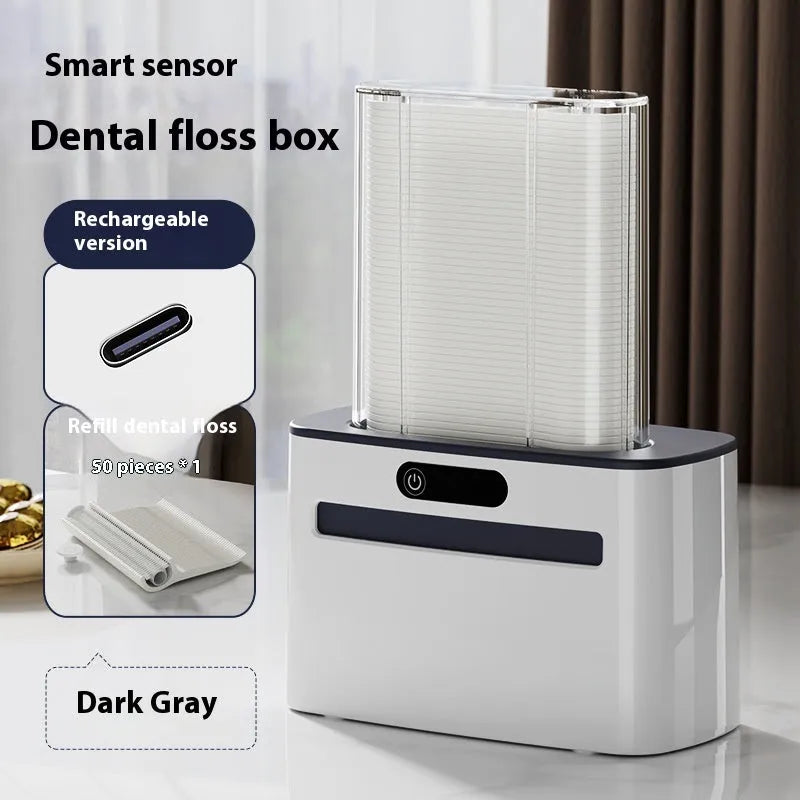 Automatic rechargeable dental floss box in dark grey, gold, and light grey colour options showing pop-up floss mechanism.
