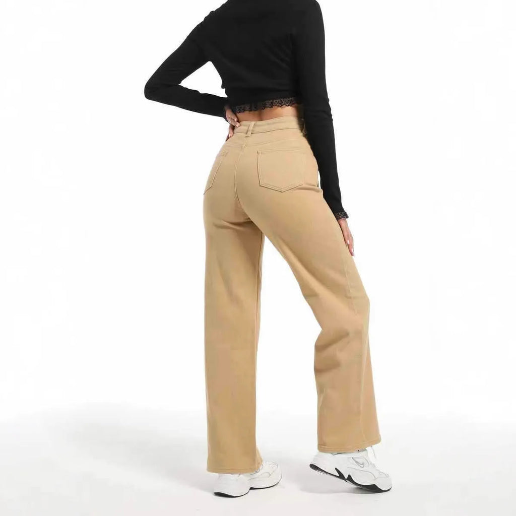Women's high-waisted straight leg wide jeans in apricot colour on a hanger.