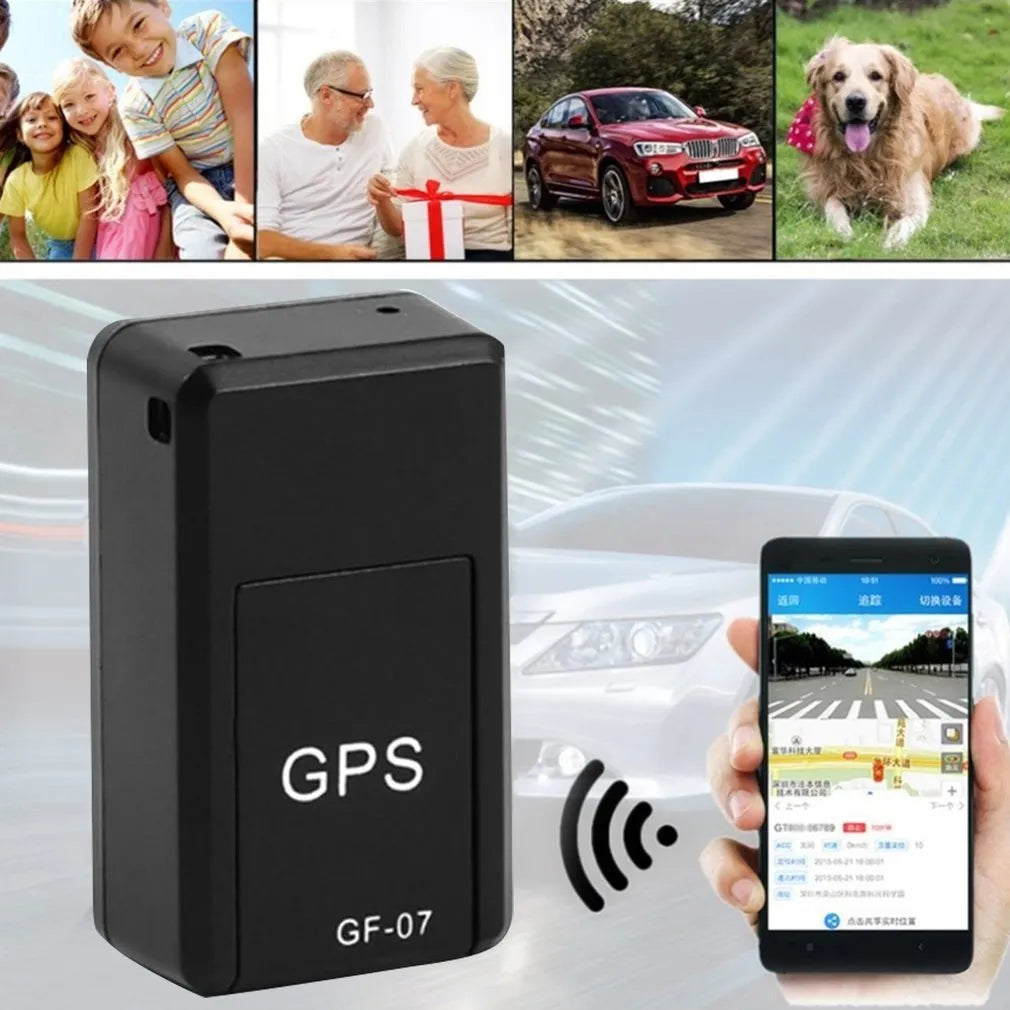 Black mini magnetic GPS tracker next to USB charging cable on a dark surface.