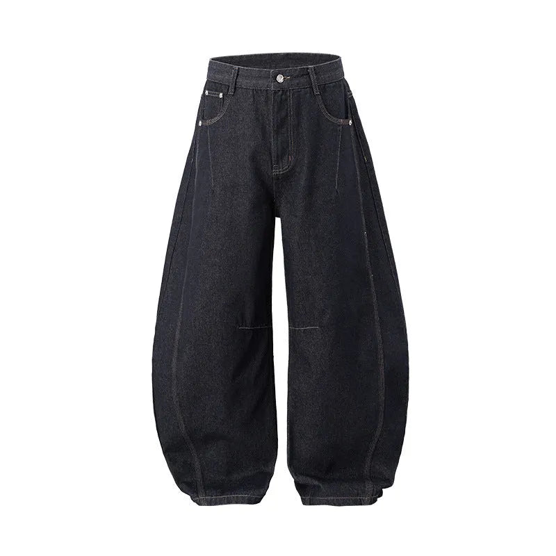 Men's wide leg denim trousers in original cow colour, showing mid waist and loose leg fit.
