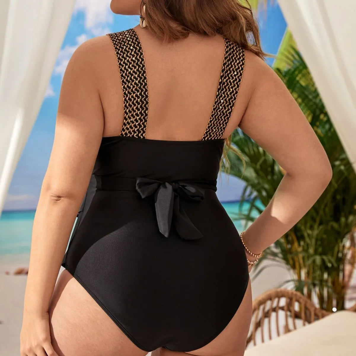 Women's black one-piece swimsuit with sleeveless design and padded cups.