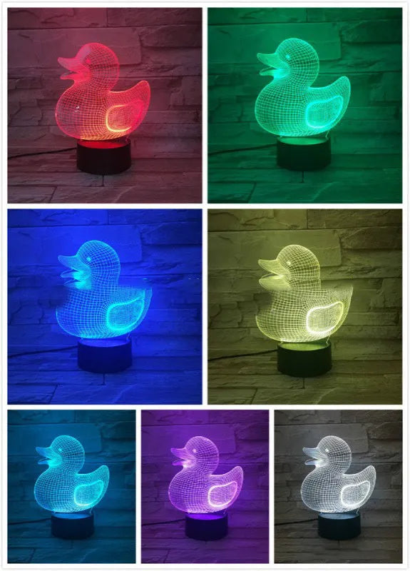 Little yellow duck 3D night light on a table showing its cartoon design and colourful illumination.
