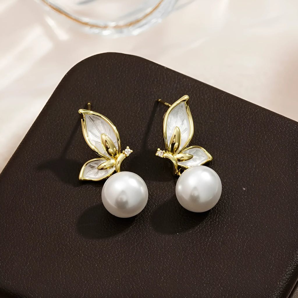 Butterfly-shaped drop earrings for women with oil painting design and zircon stone accents on copper.