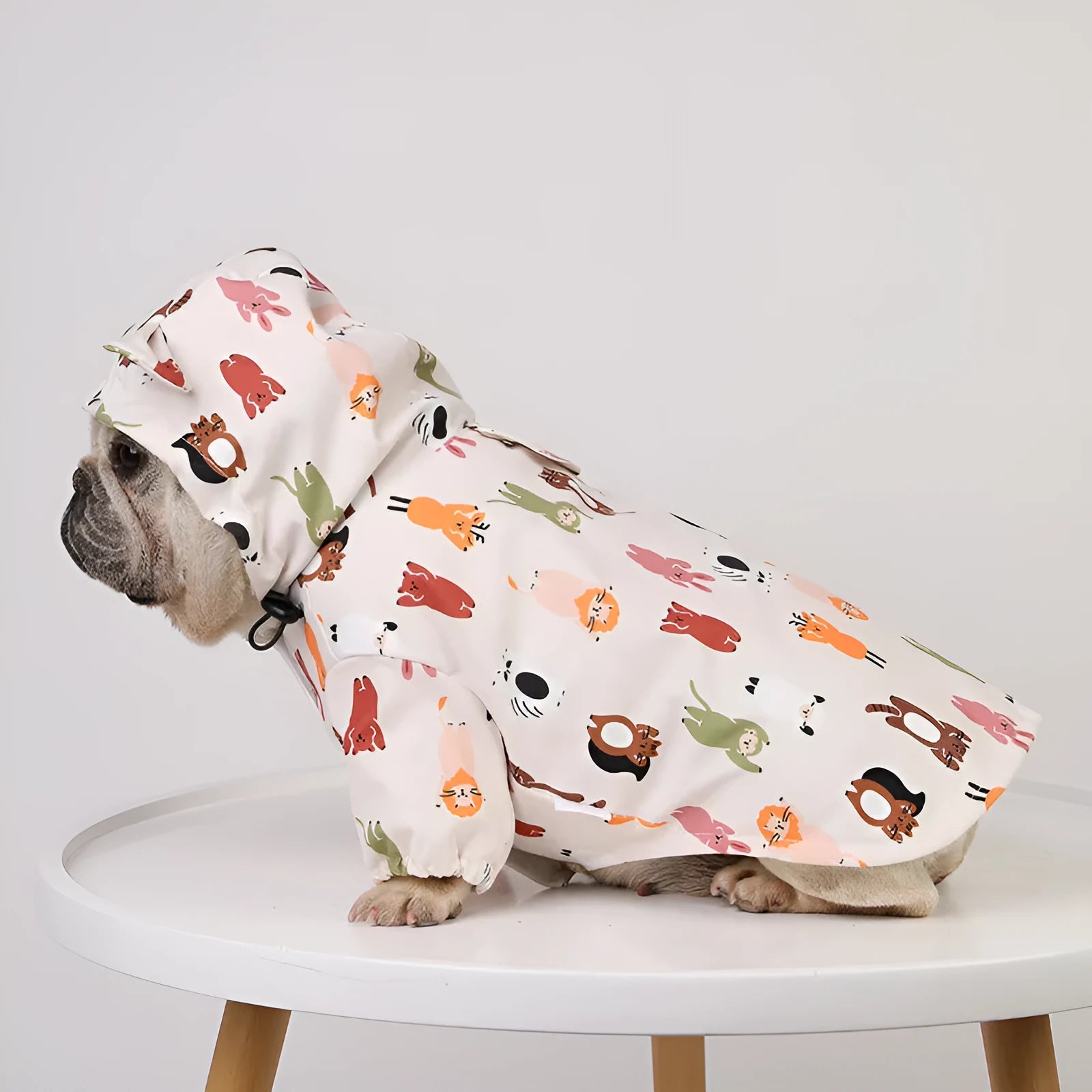Beige cartoon dog raincoat with waterproof PU coating, shown in small animal design
