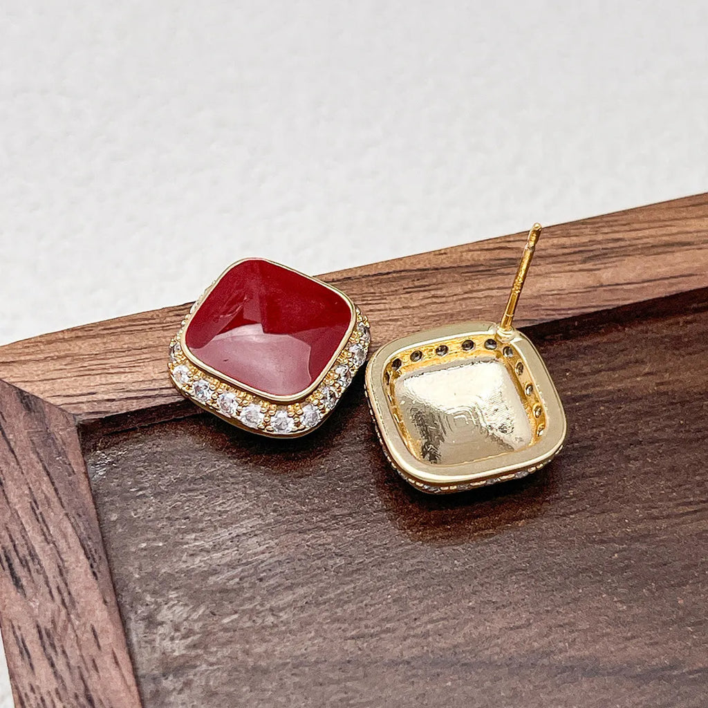 Red geometric square earrings with alloy construction and inlaid design detail